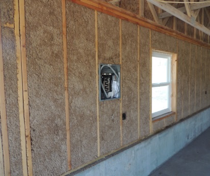 Wall cavity filled with Mountain Fiber cellulose insulation
