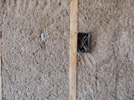 Mountain Fiber wall spray cellulose installed around wiring and an electrical box